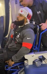 Wesley being situated for a flight looking uncomfortable.